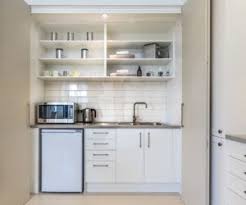 21 Stylish Kitchenettes With Optimized Designs Kitchenette Design Small Kitchenette Modern Kitchen Design