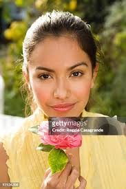 1 289 Young Woman And Beautiful And Holding A Single Flower Stock Photos,  High-Res Pictures, and Images