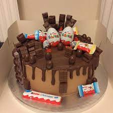 Zwei Uberraschungseier Kleinerer Schokoeier Und Kinderriegel Torte In Einer Schachtel Kinderriegel Torte Kinder Riegel Uberraschungsei Torte