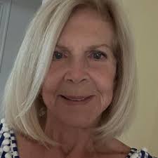 Dog admires himself in reflection