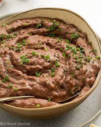 Add refried beans, break up and combine with butter, onion, and garlic. Creamy Canned Refried Black Beans A Flavor Journal