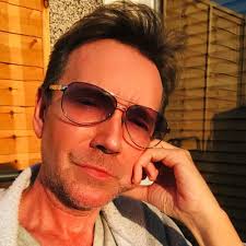 DJ John Reid Dead At 61: Remembering The Voice Behind 'Push The Feeling On' 