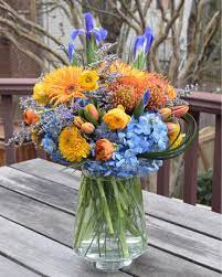 Flowers for daughter in law. Birthday Flower Bouquet For Their Daughter In Law In Pretty Orange Yellow Blue Color Tones The More Grey Sky There Is Outside The More