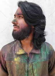 Exactly what constitutes long hair can change from culture to culture, or even within cultures. Bearded And Long Haired Indian Guy Celebrating Holi Festival And Looking His Right Side Adult Asian Attractive Bearded Bearded Man Celebration Color Powder Colored Colorful Culture Enjoy Enjoyment Expression Face Festival Fun