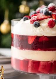 Layer whipped cream, nuts, cake, cookies, and fruit for the ultimate sweet treat. Christmas Trifle Recipetin Eats