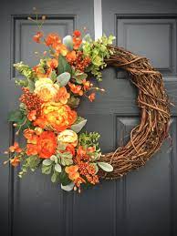 You can buy large front door wreaths in the form of a single letter of the alphabet. Orange Spring Wreath Spring Door Decor Orange Floral Wreath Spring Designs Orange And Green Spring Door Wreaths Orange Decor Spring Door Wreaths Wreath Decor Spring Wreath