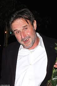 David Arquette shows off new gold teeth etched with his initials