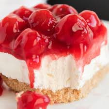 A Close Up Of A Slice Of Cake On A Plate With Cheesecake And Cherry In 2020 No Bake Cherry Cheesecake Cherry Cheesecake Recipe Cherry Cheesecake Bars Recipe