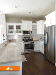 Grey Walls Stainless Steel Appliances White Cabinetry White Stone Countertops White Subway Ti Builder Grade Kitchen Kitchen Inspirations Kitchen Renovation