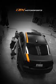 Black And Orange Car Wrap Wrap Matte Wrap Black Wrap Black Car Vehicle Wrap Motorsports Car Shop Cool Car Orange Stripe Vehicle Modification Car Wrap Vinyl Wrap Car Black Car