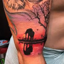 Tree silhouette tattoo silhouette photo tree line tattoo african tree baobab tree serengeti national park tree sketches tree carving nature download this african acacia tree silhouette vector illustration now. 125 Badass Elephant Tattoos For Men And Women With Meanings