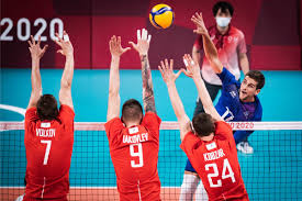 Each team tries to score points by grounding a ball on the other team's court under organized rules. 9b0wp6p5ultyrm