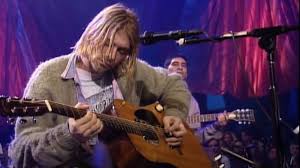 Kurt cobain rips through 'dive' in lingerie at 1993 nirvana show on the anniversary of kurt cobain's death, watch him perform an early gem in a lace slip and tiara Kurt Cobain S Guitar From Mtv Unplugged Show Draws Record Price At Auction Deadline
