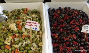 Look upwards and you see etna roaring in all its glory, look downwards and see the city fading into the turquoise, shimmering mediterranean sea below. Catania Market Sicily Part 3 Meat Cheese And The Rest Travelgumbo