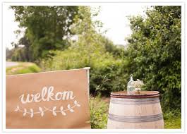 Paper Welcome Sign And Barrel Tables Countryside Wedding Camp Wedding Wedding