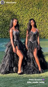 Diddy's twin daughters, D'Lila and Jessie Combs, match at prom in black  bedazzled bustier gowns