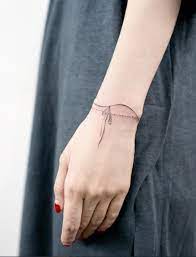 A tattoo that covers you hand and wrist, like a glove. 100 Tattoos Every Woman Should See Before She Gets Inked Tattooblend Tiny Wrist Tattoos Wrist Tattoos Girls Tattoos