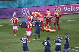 Denmark's players escort midfielder christian eriksen off the field after eriksen collapsed on the pitch. Veilmm3vea2tkm