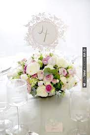 The wedding is a village fete / vintage sort of theme. Pretty Pink Centerpiece Intricate Table Numbers By Cutture Styling By Photo By Julia Boggio Pink Centerpieces Wedding Table Numbers Wedding Centerpieces