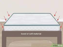 The velcro strips have an adhesive on each side that sticks to the mattress and bed base, while the corresponding velcro side of the strips keeps the mattress in place. 3 Easy Ways To Stop A Mattress From Sliding Wikihow