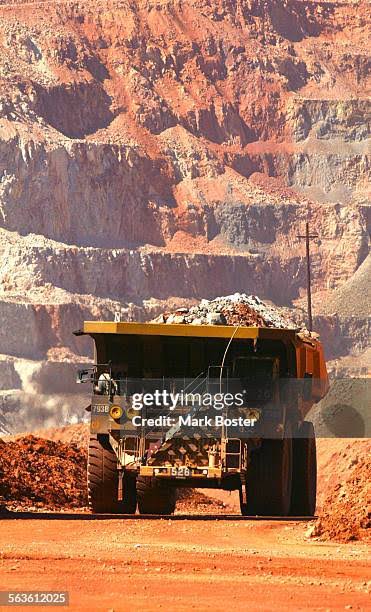 A 260–ton haul truck moving a load of copper ore with the walls of... News Photo - Getty Images