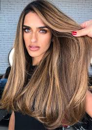 Anyone can pull off this look for casual days. Best Hair Colours To Look Younger Dark Hair With Blonde Highlights