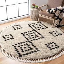 This area rug is truly versatile and will easily complement any kind of decorative style. Union Rustic Cosper Black Beige Area Rug Round Rug Living Room Plush Area Rugs Area Rugs