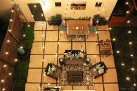 This three light hanging lantern is part of the carriage house dc collection and has an oriental bronze finish and water glass. How To Hang Outdoor String Lights Resource Article By Partylights Com