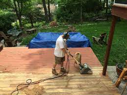 the second weekend we rented a drum sander this worked much better 12 hours of sanding most of the deckover was removed behr deckover house exterior remodel