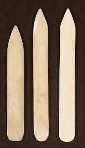 A bone folder is a simply handheld tool used to smoothen, crease, burnish, and score materials such as leather, paper, and several others. Bone Folder Wikipedia
