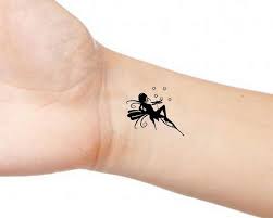 Silhouette tattoos fairy silhouette ankle henna tattoo cherub tattoo daffodil tattoo fairy tattoo designs angel images bild tattoos. Fairy 2 Temporary Wrist Or Ankle Tattoos Small Fairy Tattoos Fairy Tattoo Minimalist Tattoo