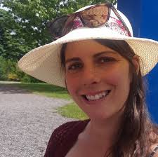 Tonight's dinner is hotdogs cut up in macaroni and cheese, baked beans and  carrot chips with dip.