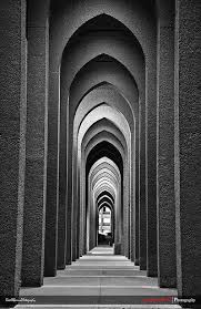 What is the regular repetition of lines shapes forms or textures in an architectural design called? Repetition Architecture Photography Pattern Photography Shape Photography Architecture Photography