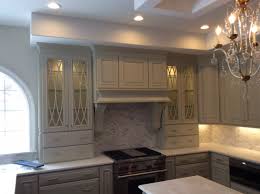 grey painted kitchen cabinetry and hood