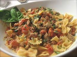 Black And White Bow Tie Pasta Bow Tie Pasta With Sausage And A Tomato White Wine Cream Sauce Pasta Dishes Tasty Dishes Bowtie Pasta