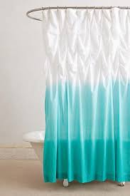 A ruffled white shower curtain gives a feminine feel to the design. Ocean Blue White Ombre Ruffled Shower Curtain