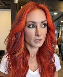 Becky Lynch & Charlotte Flair Slay the Red Carpet! 🔥💃 The Man Becky Lynch  stunned in a sleek red dress while The Queen Charlotte Flair owned the  spotlight in a stylish black