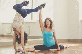 Yoga offers a huge variety of yoga poses. Young Sportive Two Girls Are Practicing Acro Yoga Exercises In Stock Photo Picture And Royalty Free Image Image 46180650