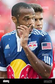 New York Red Bull's Thierry Henry gestures to a teammate as Toronto FC's Adrian  Cann looks