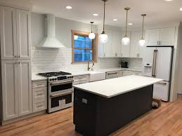 She painted the island a deep grey and installed white kashmir granite, which provides a glassy shine that reflects all. Ccc Cabinets Millennium White With Dark Grey Island Facebook