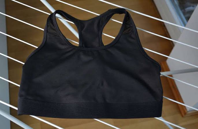 How should you care for a sports bra after swimming?