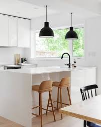 all white kitchen black cahndelier and