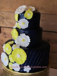 Restaurant table with wedding cake, married couple. Dramatic Royal Blue With Yellow And While Cake By Amy Cakesdecor