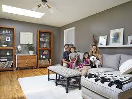 The fireplace acts as a pivot point for the design, as it faces the bay view while its backside becomes the crossing main hallway and a shaft of light becomes the center. Natural Light From Skylights Brings Harmony To Living Room Decor
