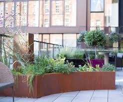 During the weathering process the corten steel produces carbon run off which can stain adjacent. Bespoke Faux Corten Steel Planters For Balcony Livingreen Design Esi External Works