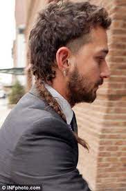 Shia Labeouf Puts On A Sharp Suit Keeps The Rat Tail And Eyebrow Ring Mohawk Hairstyles Men Mullet Hairstyle Rat Tail Haircut