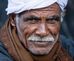 A Smile A Day. I met this Egyptian gentleman in a small village just a  short distance from Valley of the Kings. A frigid morning, he gave me his  confident glance as