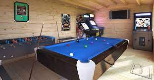 The two bedrooms on the lower level open to a game room and media center perfect for family fun. Log Cabin Games Room 7 Steps To Creating A Recreation Sanctuary