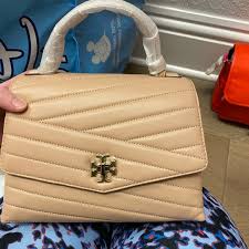 Carry by the top handle or by the curb chain handle, and for hands free use the detachable shoulder strap. Tory Burch Bags Nwt Tory Burch Kira Chevron Top Handle Satchel Poshmark