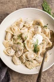 Classic Russian Pelmeni Recipe Thin Dough Filled With Garlic Chicken And Pork Filling Served With Butter Russian Pelmeni Recipe Pelmeni Recipe Meat Dumplings